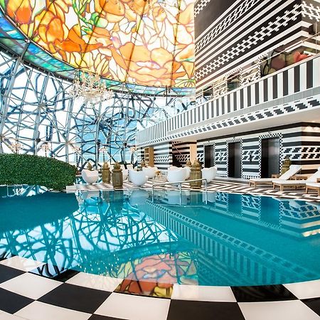 Hotel Mondrian Ad Dawhah Esterno foto The pool at the hotel